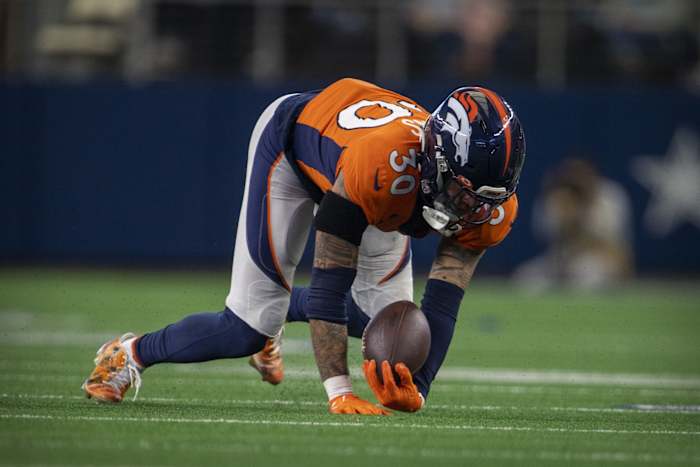Denver Broncos safety Caden Sterns (30) intercepts a pass by Dallas Cowboys quarterback Dak Prescott (not pictured) during the second half at AT&T Stadium.